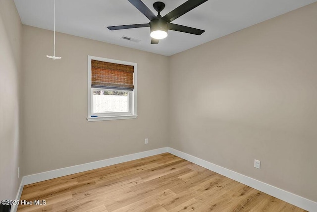 unfurnished room with ceiling fan and hardwood / wood-style floors