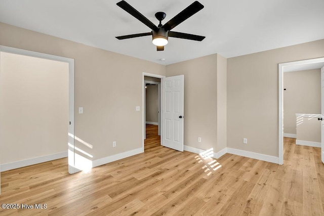 unfurnished bedroom with ceiling fan and light wood-type flooring