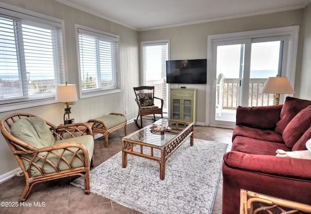 living room with tile patterned flooring and crown molding