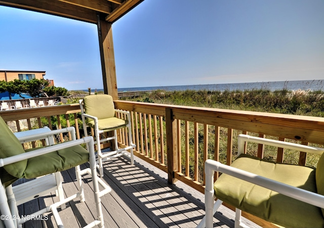 wooden deck featuring a water view