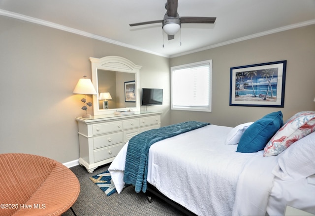 carpeted bedroom featuring crown molding and ceiling fan