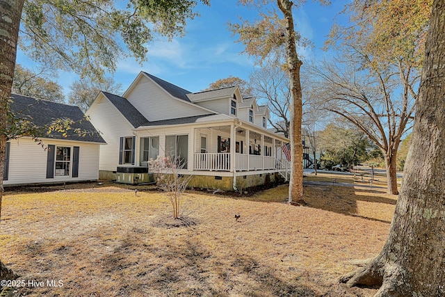 exterior space with crawl space, covered porch, central AC, and roof with shingles