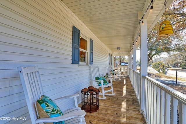 wooden deck featuring covered porch