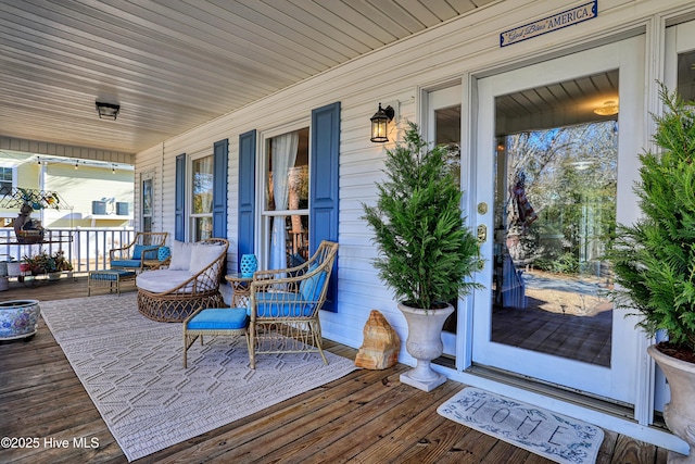 wooden deck featuring a porch