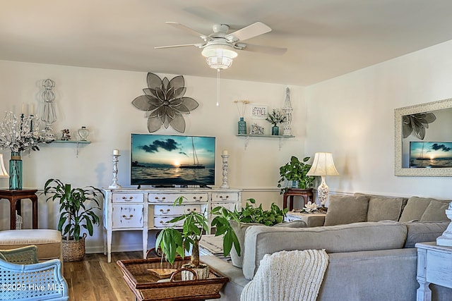 living area featuring ceiling fan and wood finished floors