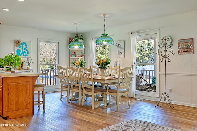 dining room featuring recessed lighting and light wood-style flooring