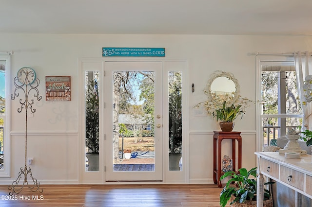 foyer entrance with wood finished floors