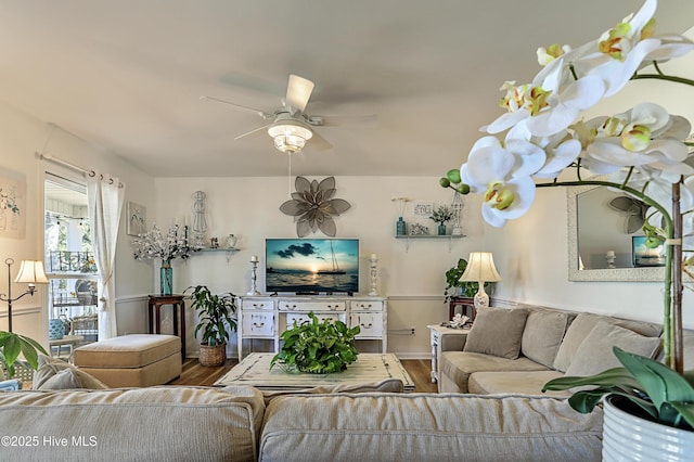 living room featuring ceiling fan and wood finished floors