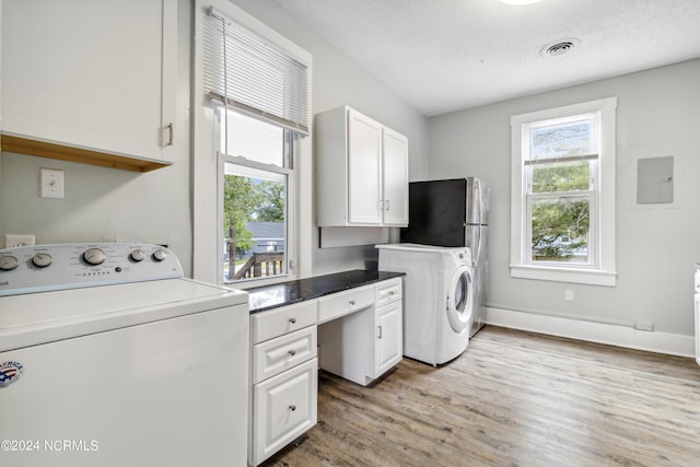 kitchen featuring a sink, visible vents, electric stove, stainless steel microwave, and washer / dryer