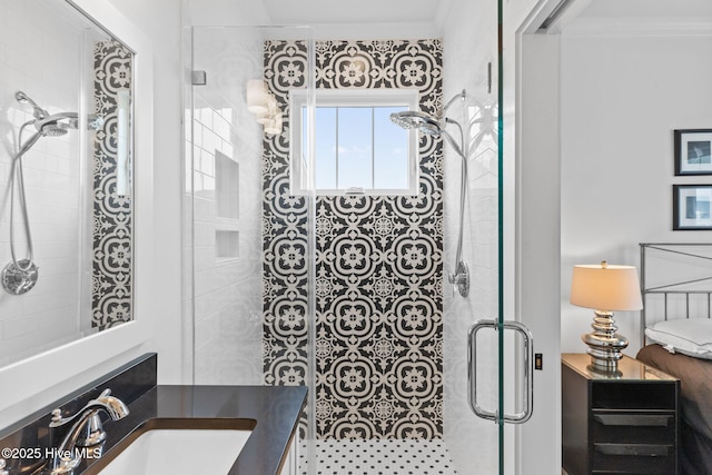 bathroom with vanity, a shower with shower door, and ornamental molding