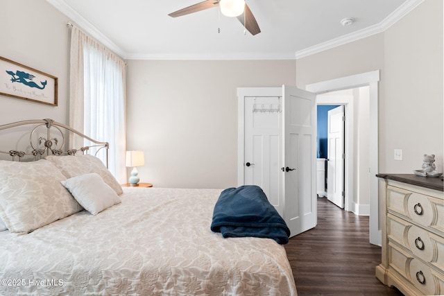 bedroom with dark wood-type flooring, ornamental molding, and ceiling fan