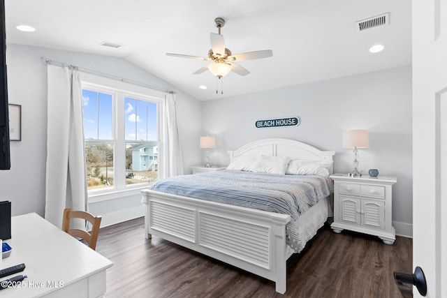 bedroom with dark wood-type flooring, ceiling fan, and vaulted ceiling