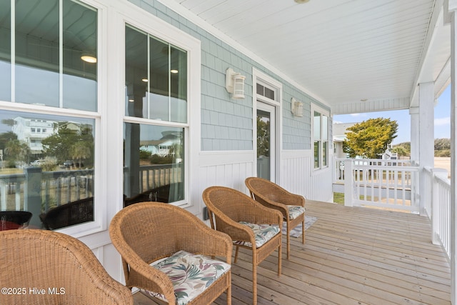 wooden terrace with a porch