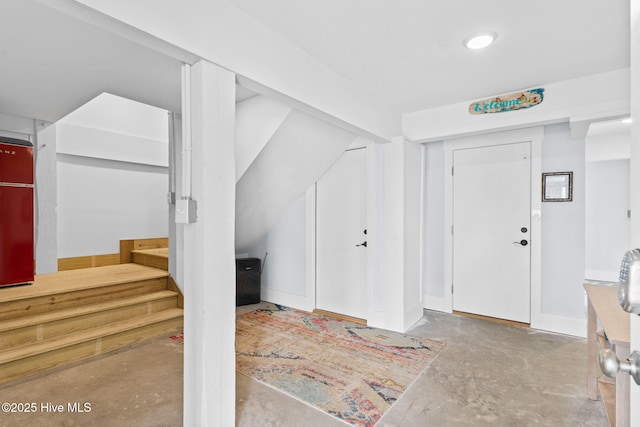 foyer entrance with concrete floors