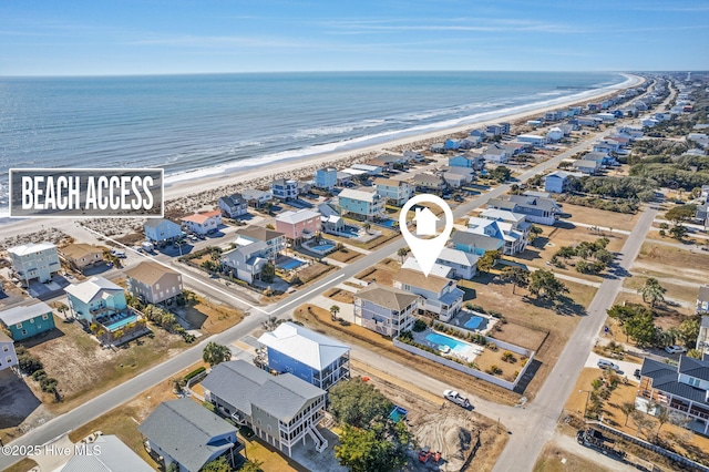 bird's eye view with a beach view and a water view