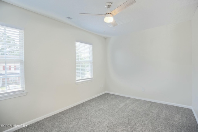 carpeted empty room with ceiling fan