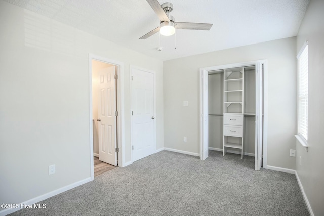 unfurnished bedroom featuring light colored carpet and ceiling fan