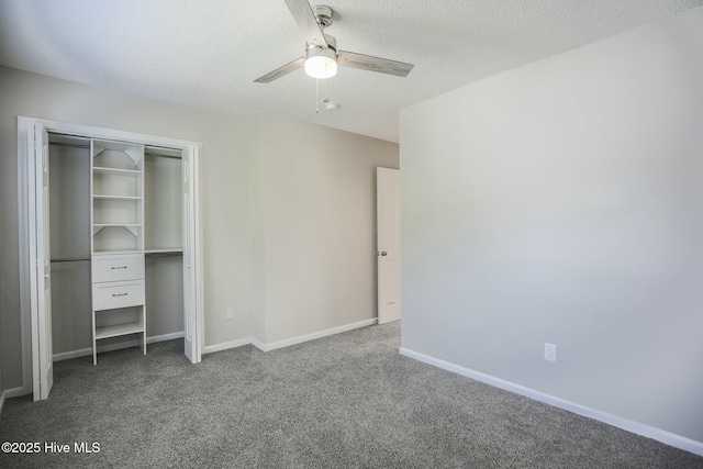 unfurnished bedroom with ceiling fan, a closet, carpet floors, and a textured ceiling