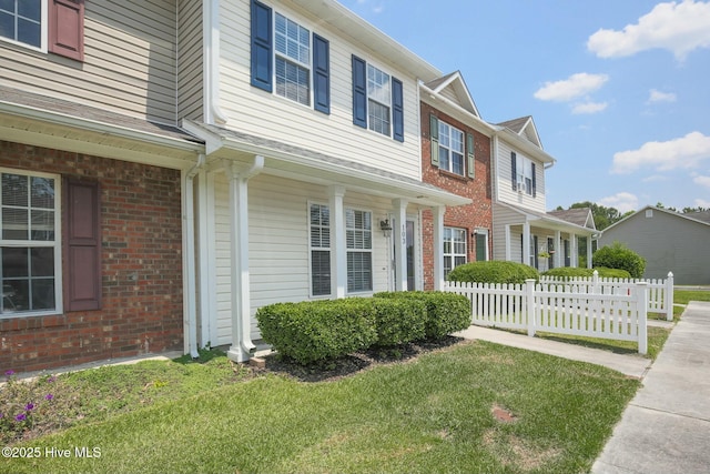 view of home's exterior with a yard