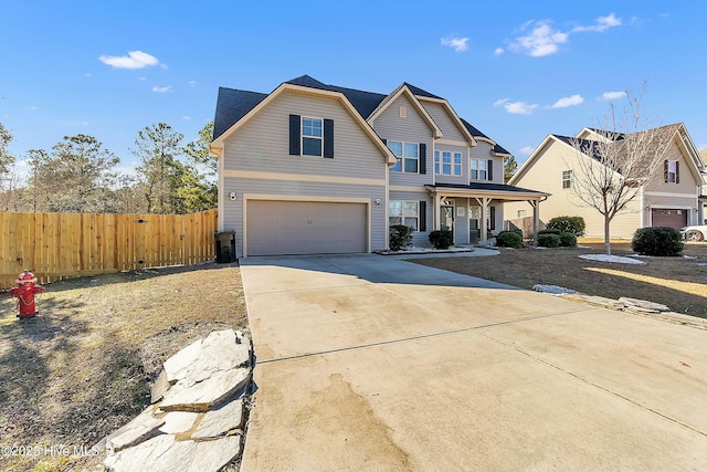 view of front of property with a porch and a garage