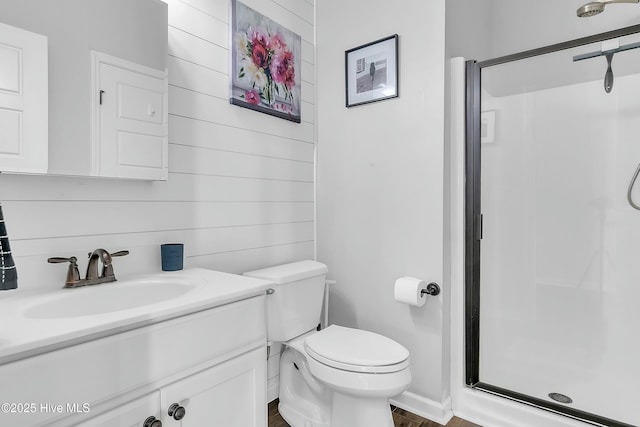 bathroom with vanity, toilet, and walk in shower