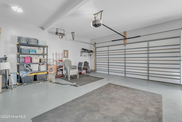 garage featuring a garage door opener and electric panel