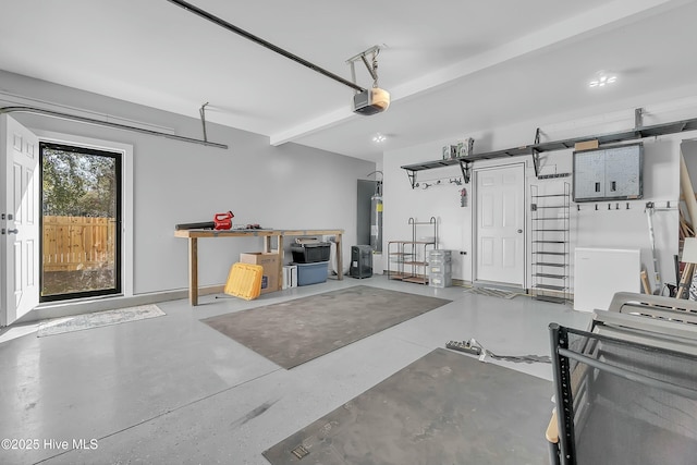 garage featuring a garage door opener and water heater