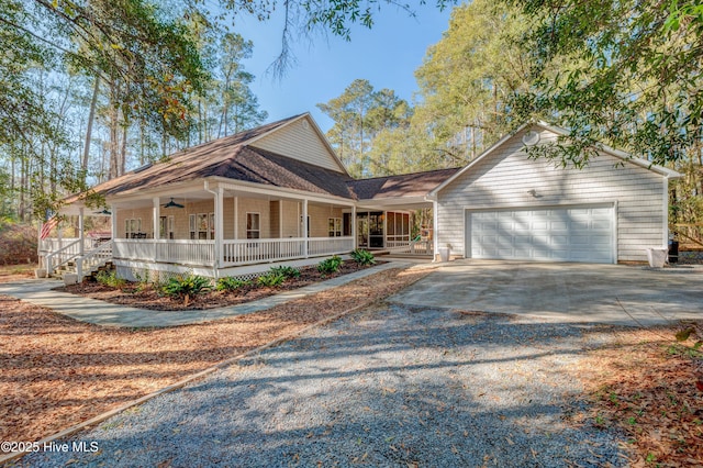 country-style home with a garage and covered porch