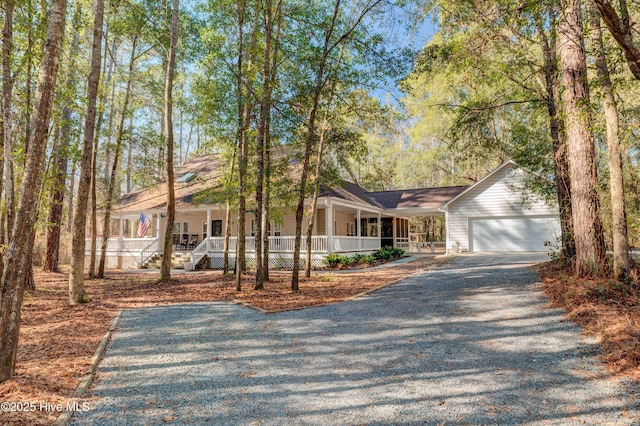 ranch-style home with a garage and a porch