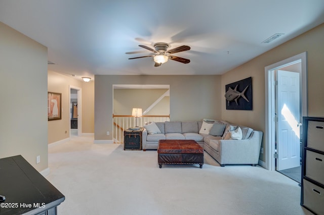 living room with light carpet and ceiling fan