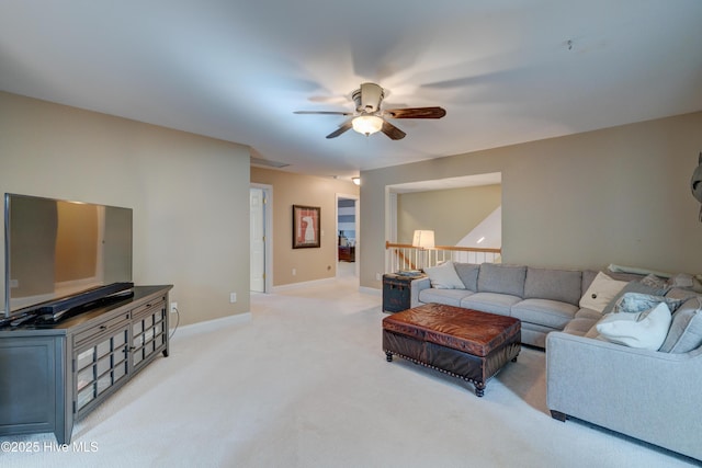 living room with light colored carpet and ceiling fan