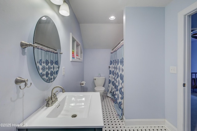 bathroom featuring vanity, toilet, and a shower with shower curtain