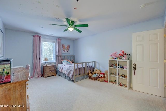 bedroom with light carpet and ceiling fan