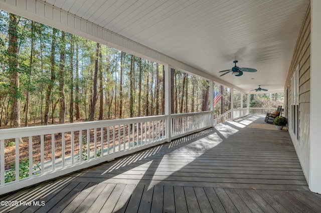 wooden deck featuring ceiling fan