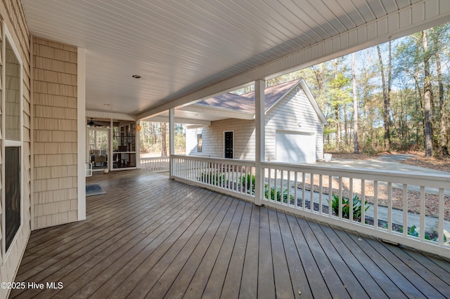 wooden terrace featuring a garage