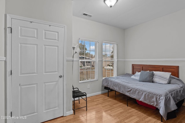 bedroom with light wood-type flooring