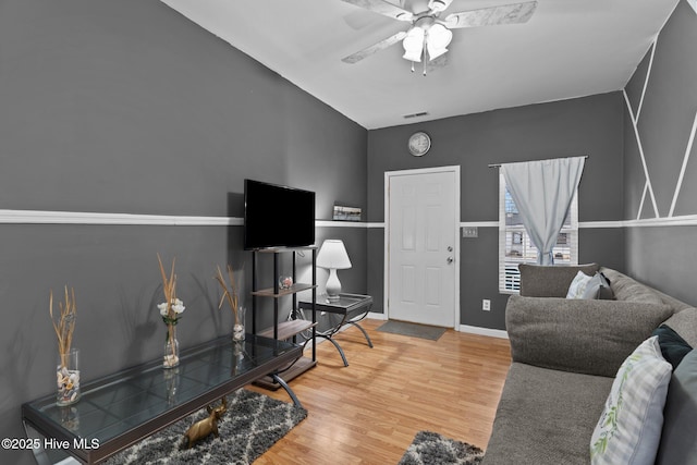 home office featuring wood-type flooring and ceiling fan