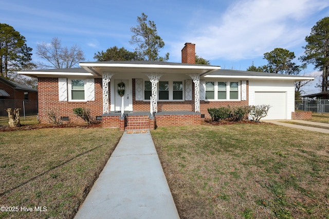 view of front of home featuring a garage, covered porch, and a front lawn