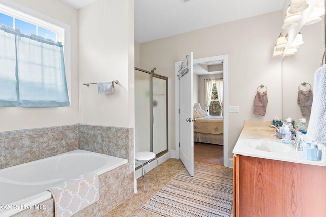 bathroom with vanity, tile patterned floors, and shower with separate bathtub