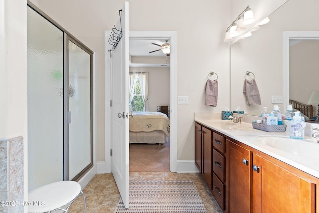 bathroom featuring vanity, tile patterned flooring, and walk in shower