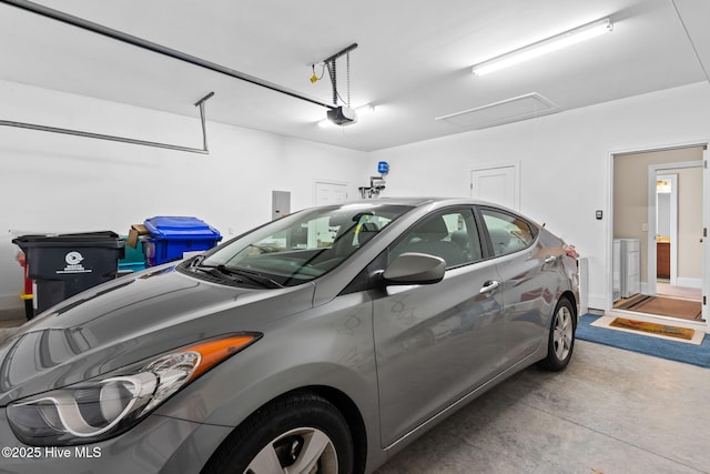 garage featuring a garage door opener