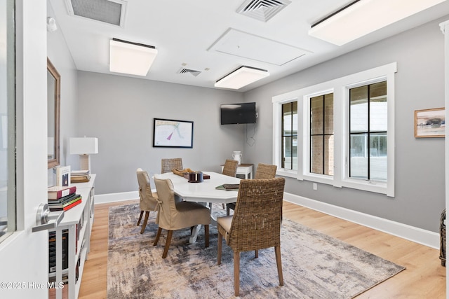 dining room with light hardwood / wood-style flooring