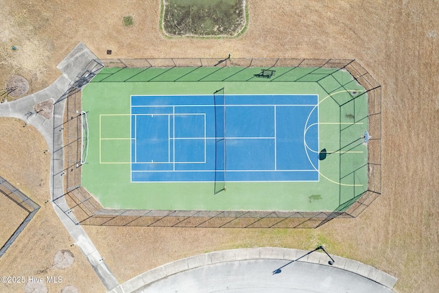 view of tennis court featuring basketball court