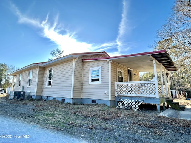 view of property exterior with covered porch