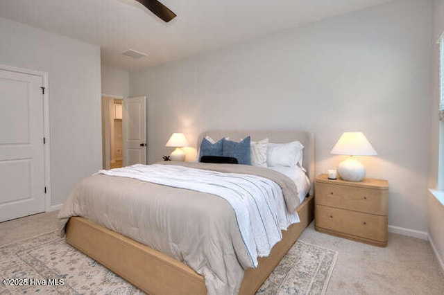 bedroom featuring carpet and baseboards