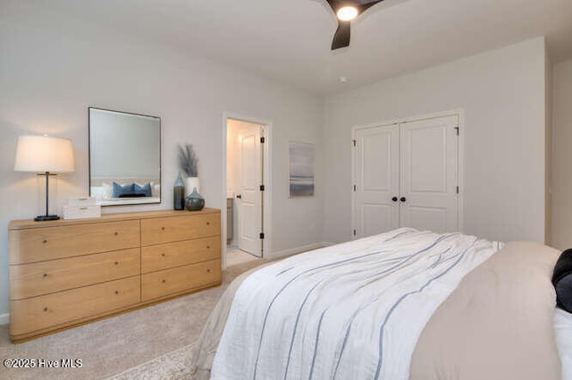 bedroom with a closet, light carpet, and ceiling fan