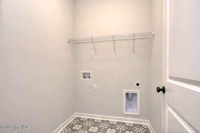 laundry area featuring baseboards, laundry area, hookup for a washing machine, and hookup for an electric dryer