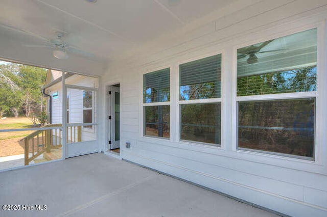 view of patio featuring ceiling fan