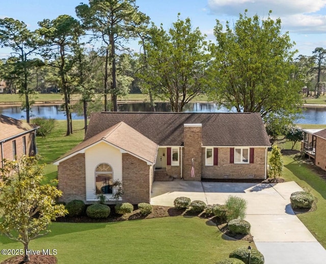 view of front of property with a water view and a front yard