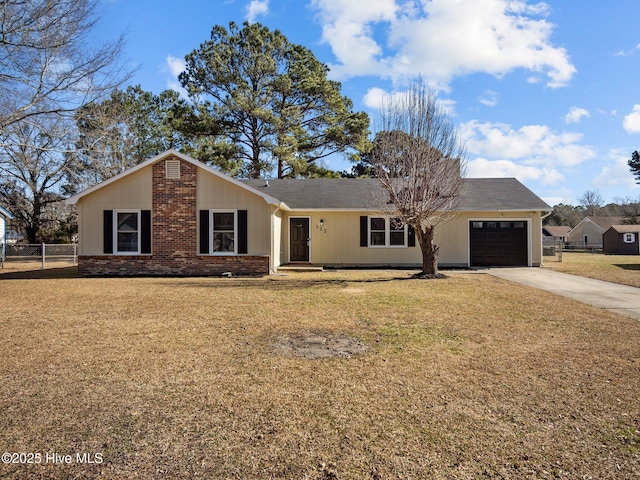 ranch-style home with a garage and a front yard